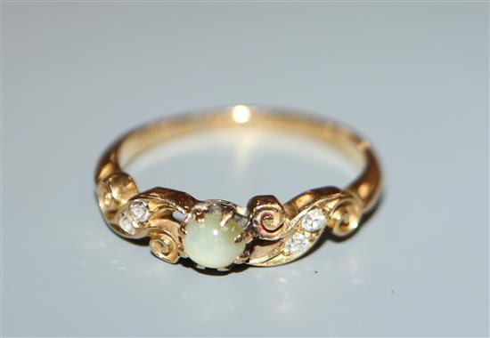 An Edwardian 18ct gold, cats eye chrysoberyl and diamond set dress ring, size M/N.